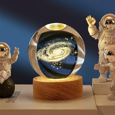 3D galaxy crystal ball with astronauts