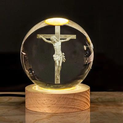Religious engraved crystal ball on LED base